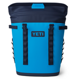 Yeti Hopper M20 Soft Backpack Cooler - A large, blue soft-sided cooler with a backpack-style shoulder strap and two zippered pockets on the front.