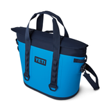 Yeti Hopper M30 2.0 Soft Cooler - A blue cooler with a black handle and zipper, featuring a rectangular shape and two handles on top.