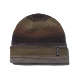 Stance Gauge Beanie 2024 - A brown beanie with a striped pattern and a black tag on the cuff that reads "STANCE" in white letters.