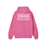 Union Team Hoodie 2026 - A pink hoodie with a white logo on the chest and a hood.