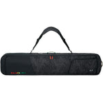 Dakine Tour Snowboard Bag - A black snowboard bag with a subtle gray pattern and red zipper pull.