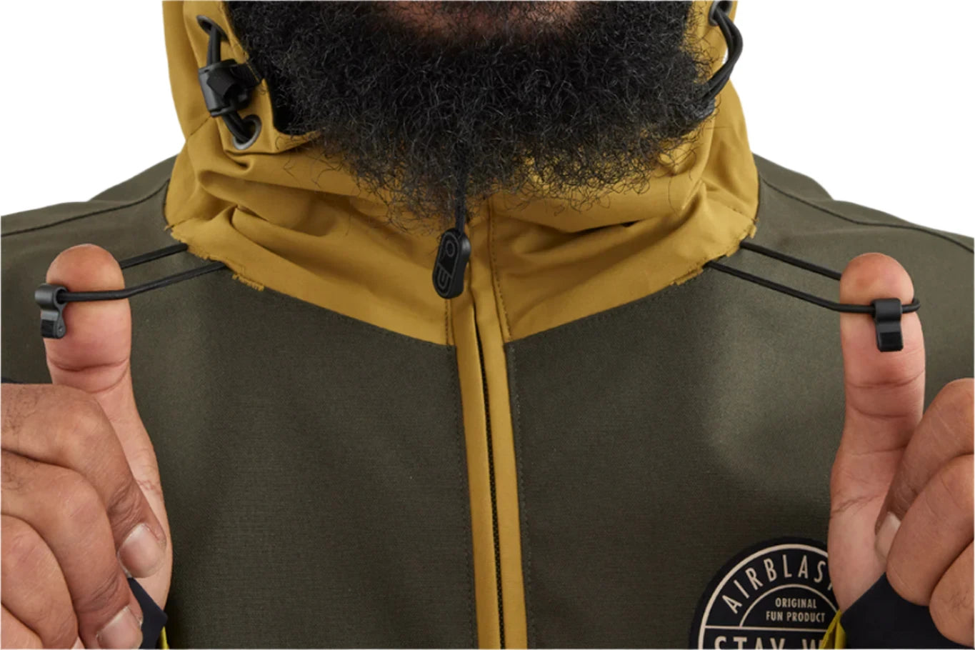 Airblaster Trenchover Half Zip Shell Jacket 2025 - A dark green jacket with a zippered front and two black drawstrings at the hood.