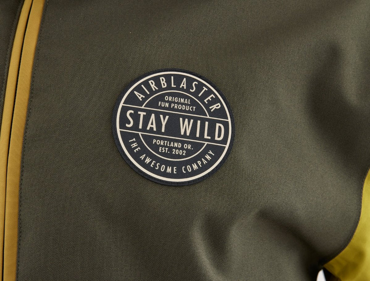 Airblaster Trenchover Half Zip Shell Jacket 2025 - Olive green jacket with a round logo on the chest featuring white and black lettering.