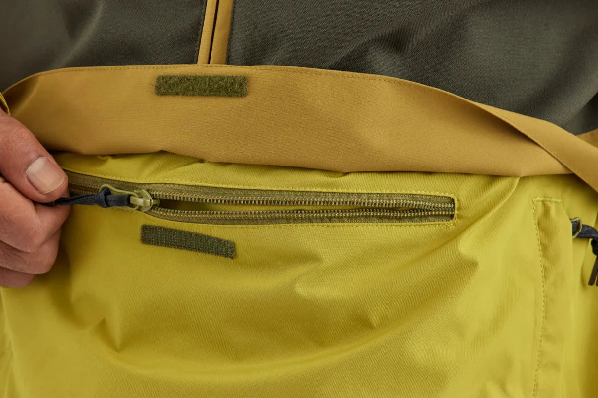 Airblaster Trenchover Half Zip Shell Jacket 2025 - A black jacket with a half-zip front and two zippered pockets on the chest.