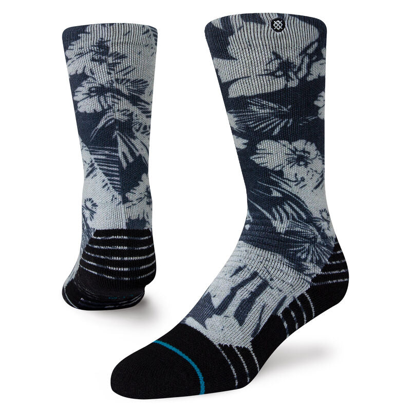 Tropic Chill Kids Sb Sock 2022 - A pair of gray socks with a tropical print featuring palm trees and hibiscus flowers.