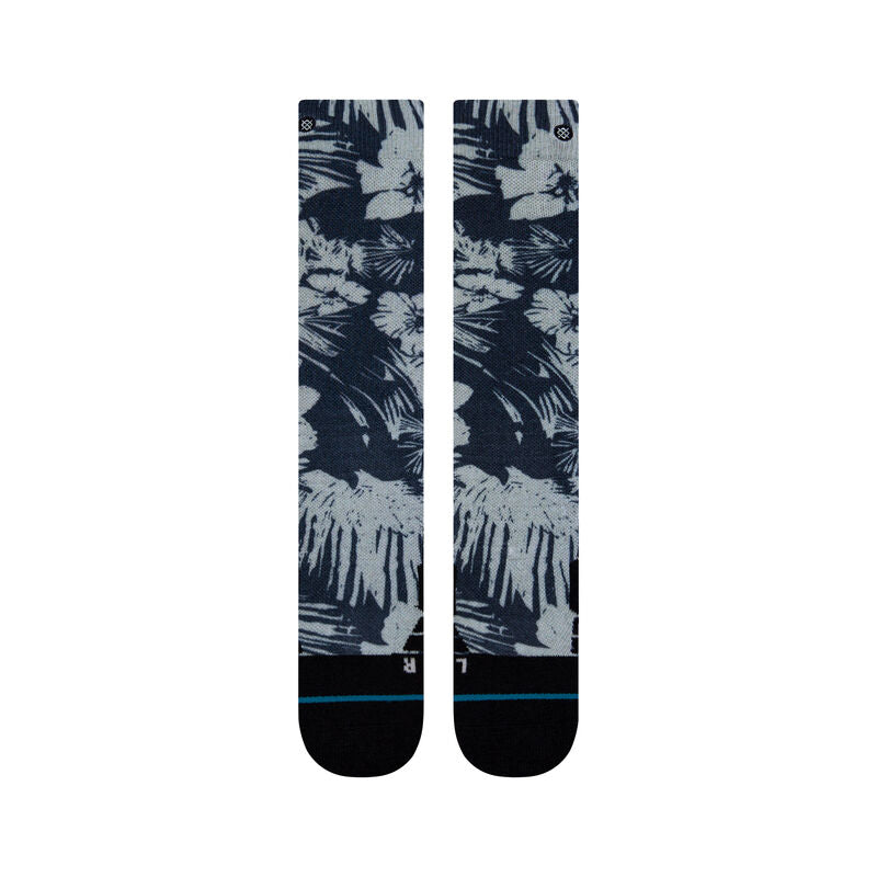 Tropic Chill Kids Sb Sock 2022 - A pair of navy blue socks with a tropical print featuring palm trees and leaves in white, gray, and light blue hues.