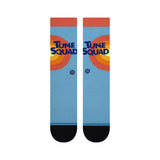 Tune Squad Crew C Sock 2022 - A pair of crew socks with a light blue background and an orange, yellow, and red target design on the top portion.