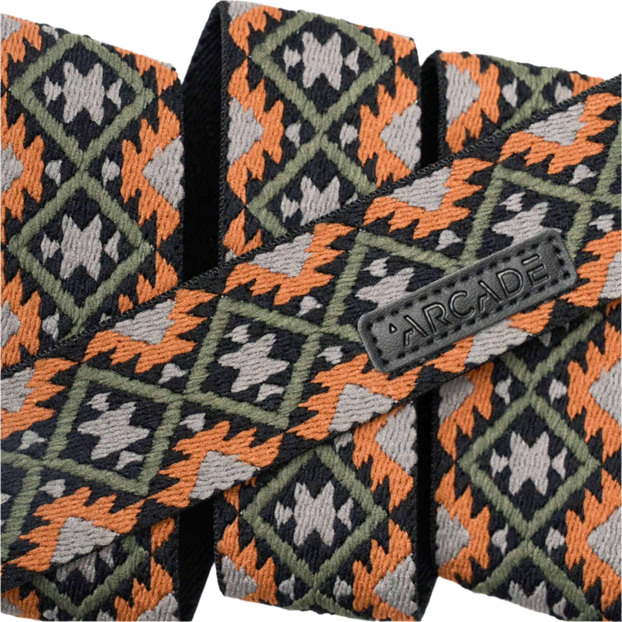 Arcade Twilight Belt Slim 2025 - A black belt with a repeating pattern of orange, gray, and green triangles.