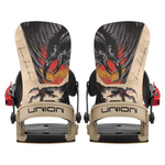 Union Atlas Pro Kazu Snowboard Binding - A black snowboard binding with a red strap and silver screws, featuring a large eagle graphic on top of a yellow flame design.