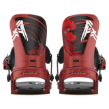 Pair of red snowboard bindings, front view with black straps and dragon artwork