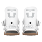 Pair of women’s snowboard bindings in white, front view with two highbacks and toe/ankle straps