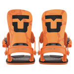 Pair of orange snowboard bindings, front view, with black soles and straps