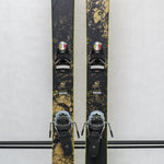 USED - Rossignol Black Ops Sender Ti with Pivot 14 Bindings - A black ski with a yellow and white logo on top, featuring a marbled pattern of tan and black.