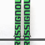 USED - Rossignol Black Ops Holyshred with SPX12 Bindings - A pair of skis with a black and green color scheme, featuring a distinctive rooster logo on the top sheet.