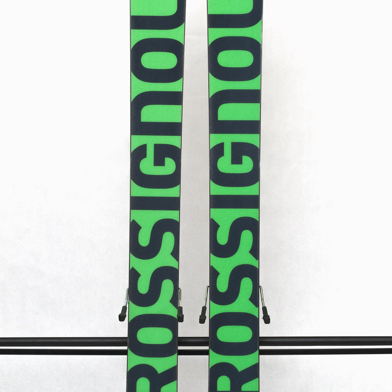USED - Rossignol Black Ops Holyshred with SPX12 Bindings - A pair of skis with a black and green color scheme, featuring a distinctive rooster logo on the top sheet.