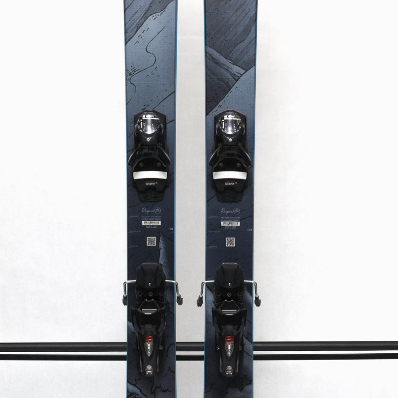 USED - Rossignol Blackops 98 with SPX 12 Demo Bindings - A pair of skis with a black and white marbled pattern on the tops, featuring a distinctive "Blackops" logo in silver.