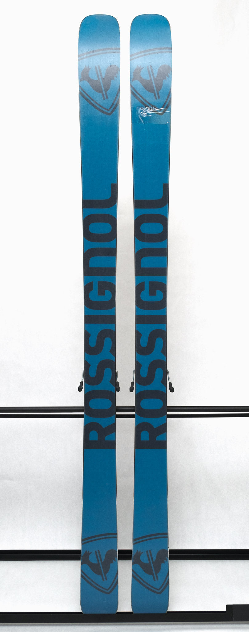 USED - Rossignol Blackops 98 with SPX 12 Demo Bindings - A pair of skis featuring a black base color and silver lettering, with two bindings attached to the top.
