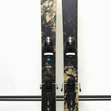 USED - Rossignol Black Ops Sender Ti with SPX 12 Bindings - A black ski with a yellow sticker on its tip and silver bindings.