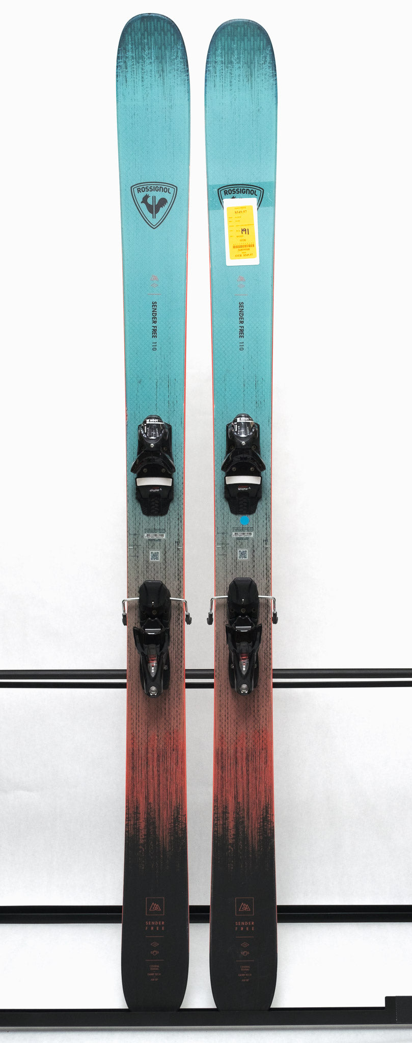 USED - Rossignol Sender Free 110 2025 with SPX 12 Demo Bindings - A pair of skis with a light blue base and black bindings.