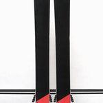 USED - Head Kore 99 with Attack 14 Bindings - A pair of skis with a black base and white lettering, featuring the word "HEAD" on one ski and "KORE" on the other.