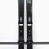 USED - Salomon Stance 90 2022 with STH13 Bindings - A pair of skis and bindings, featuring a dark gray color scheme with white lettering on the Salomon logo.