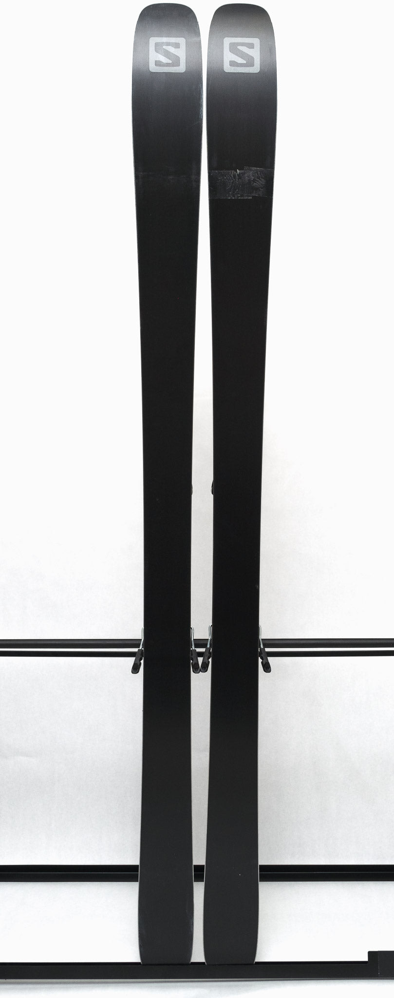 USED - Salomon Stance 90 2022 with STH13 Bindings - A pair of skis featuring a black base and white lettering on the bindings.