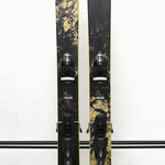 USED - Rossignol Black Ops Sender Ti with SPX 12 Bindings - A black ski with a marbled yellow and black pattern on the tip and tail, featuring silver bindings.