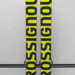 USED - Rossignol Black Ops Sender Ti with SPX 12 Bindings - A pair of skis featuring a sleek black design, with silver bindings and a subtle sheen on the surface.