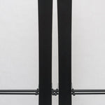 USED - Rossignol Black Ops Escaper with AM 12 Bindings - A pair of skis with black bases and white tops, featuring a distinctive logo on the top of each ski.
