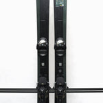 USED - Salomon Stance 90 2022 with Warden 13 Bindings - A pair of skis with a dark green base color and white lettering, featuring the Salomon logo on the top.