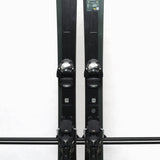 USED - Salomon Stance 90 2022 with Warden 13 Bindings - A pair of skis with a dark green base color and white lettering, featuring the Salomon logo on the top.