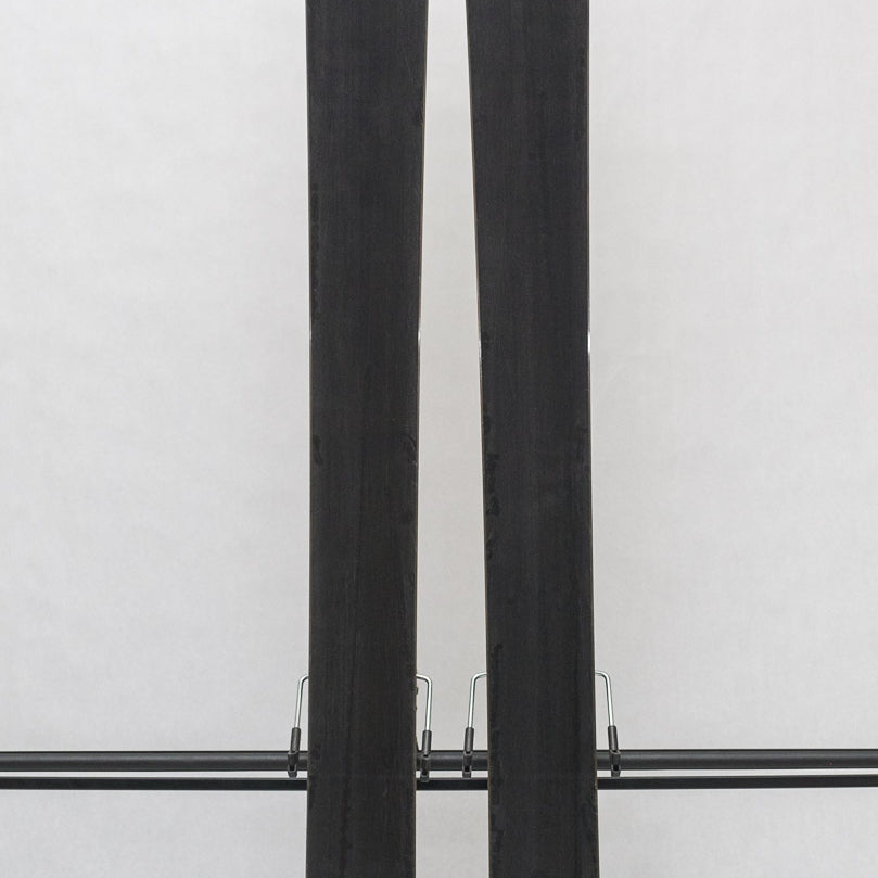 USED - Rossignol Black Ops Escaper with Pivot 12 Bindings - A pair of skis featuring a black base and white tops, with a distinctive logo on top.