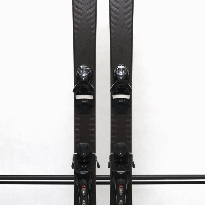 USED - Rossignol Experience 86Ti with SPX12 Bindings - A pair of black skis with red accents and silver bindings.