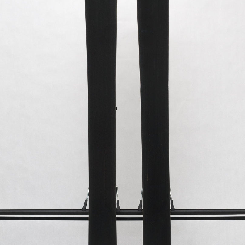 USED - Rossignol Experience 86Ti with SPX12 Bindings - A pair of skis with a white top and black bottom, featuring a distinctive "Rossignol" logo on the tip.