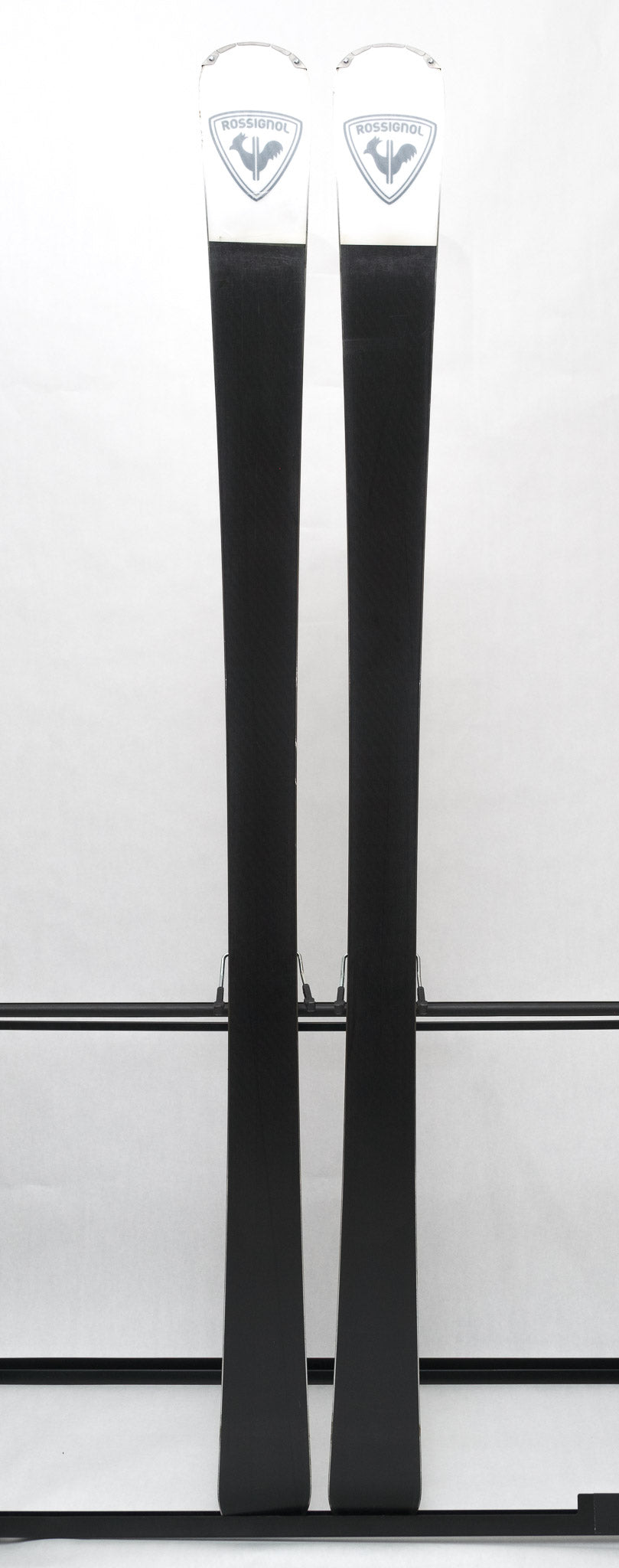 USED - Rossignol Experience 86Ti with SPX12 - A pair of skis featuring a white base with black lettering and logos, including "Rossignol" on the top of one ski.