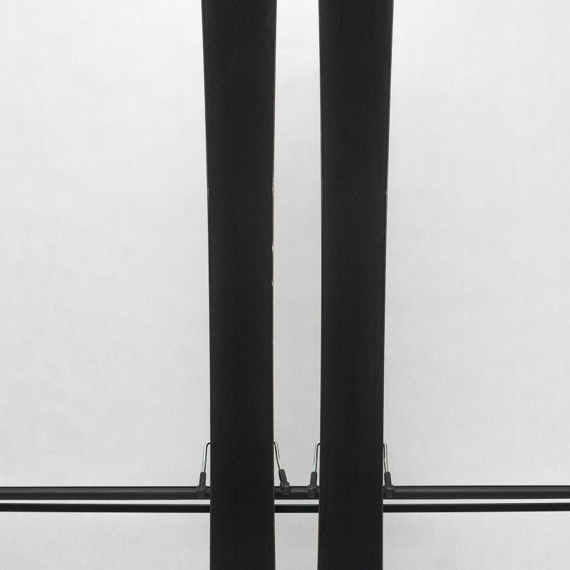 USED - Rossignol Experience 86Ti with SPX12 - A pair of skis featuring a white base with black lettering and logos, including "Rossignol" on the top of one ski.