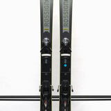 USED - Rossignol Arcade 84 with SPX 12 Demo Bindings - A pair of skis with a gray base and black tops, featuring the Rossignol logo on the top of each ski.