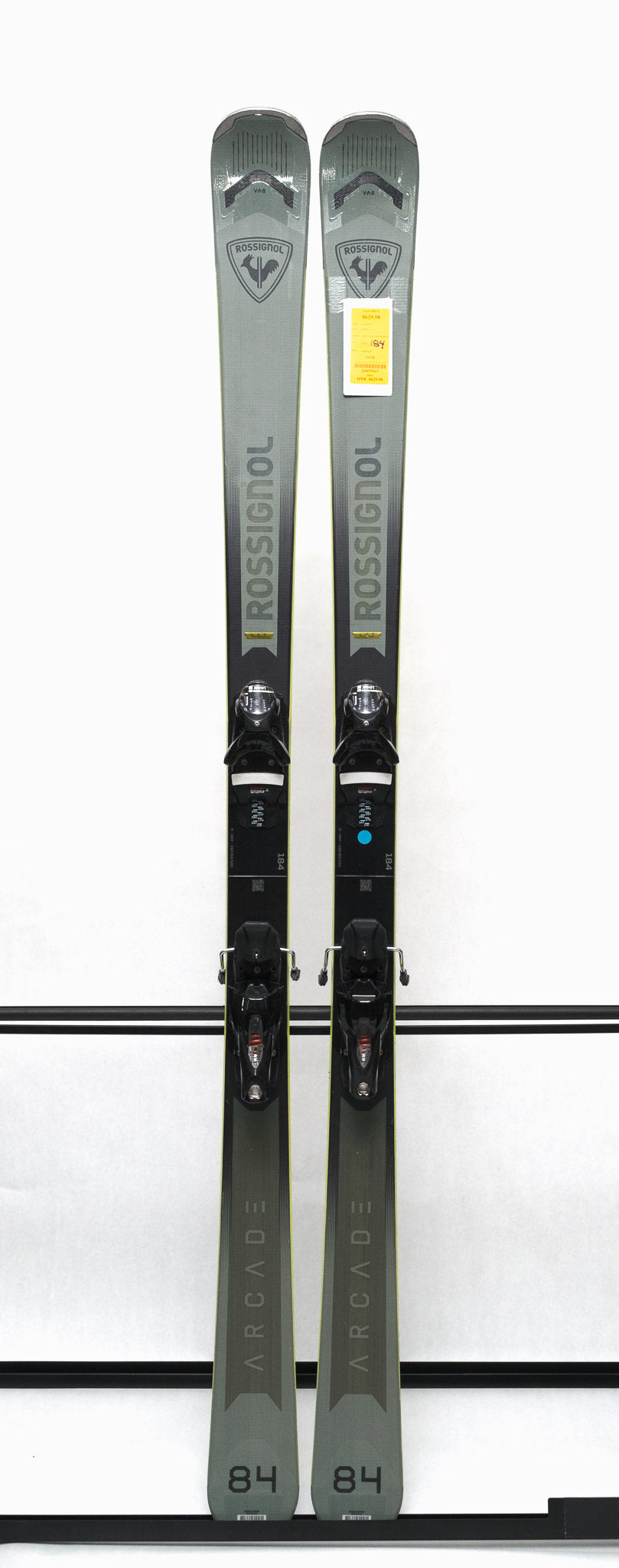 USED - Rossignol Arcade 84 with SPX 12 Demo Bindings - A pair of skis with a gray base and black tops, featuring the Rossignol logo on the top of each ski.