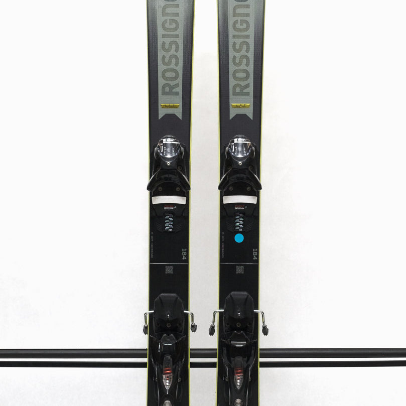 USED - Rossignol Arcade 84 with SPX 12 Demo Bindings - A pair of skis with a gray base and black tops, featuring the Rossignol logo on the top of each ski.