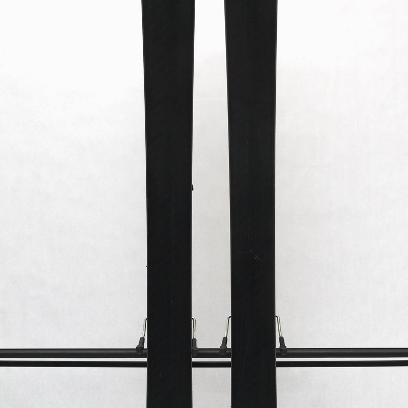 USED - Rossignol Arcade 84 with SPX 12 Demo Bindings - A pair of skis featuring a yellow and black color scheme, with a distinctive rooster logo on the top of each ski.