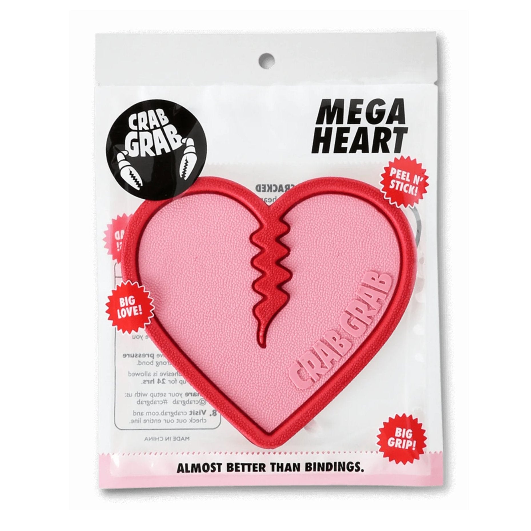 Crab Grab Mega Heart Stomp Pad 2025 - A pink heart-shaped pad with a jagged line down the middle, featuring the words "CRAB GRAB" embossed on it.