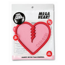 Crab Grab Mega Heart Stomp Pad 2025 - A pink heart-shaped pad with a jagged line down the middle, featuring the words "CRAB GRAB" embossed on it.