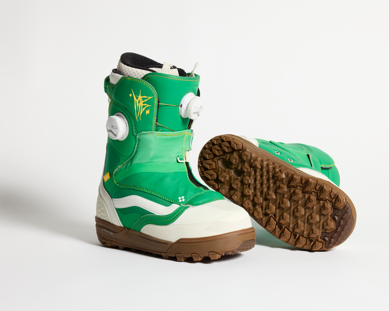 Vans green snowboard boots with white strap, BOA dial, and brown tread sole