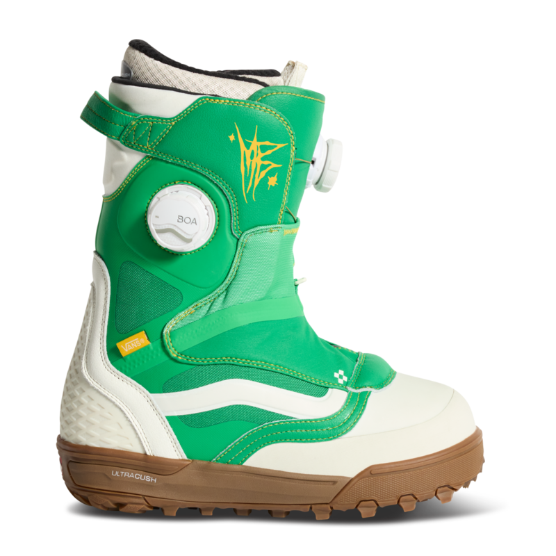 Vans green and white snowboard boot with yellow graphics, padded collar, and rubber sole