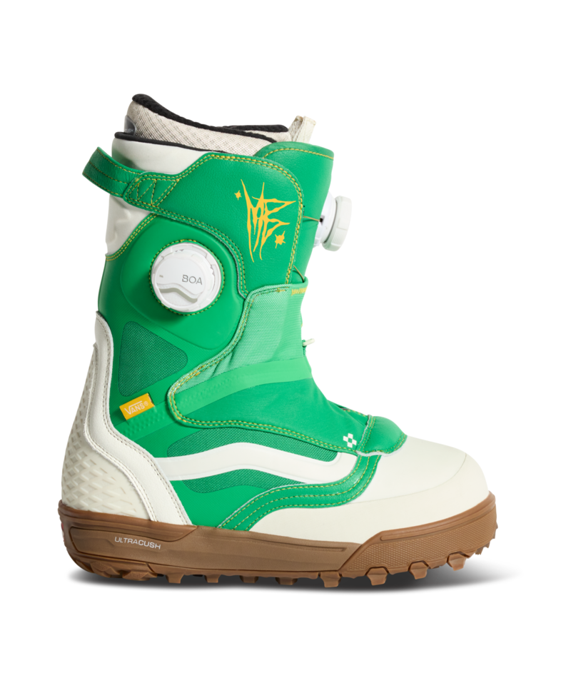 Vans green and white snowboard boot with yellow graphics, padded collar, and rubber sole