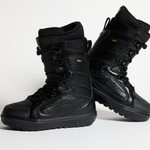 Pair of black lace-up snowboard boots with padded cuffs and patterned leather panels.