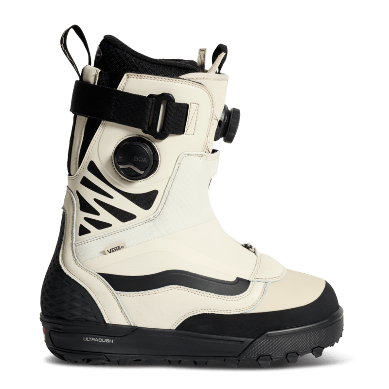 Snowboard boot with BOA dial and black strap; cream upper, black sole