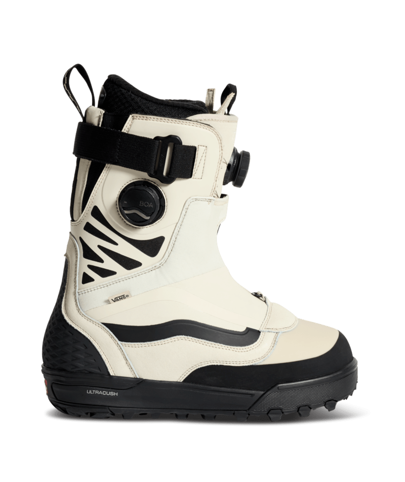 Snowboard boot with BOA dial and black strap; cream upper, black sole