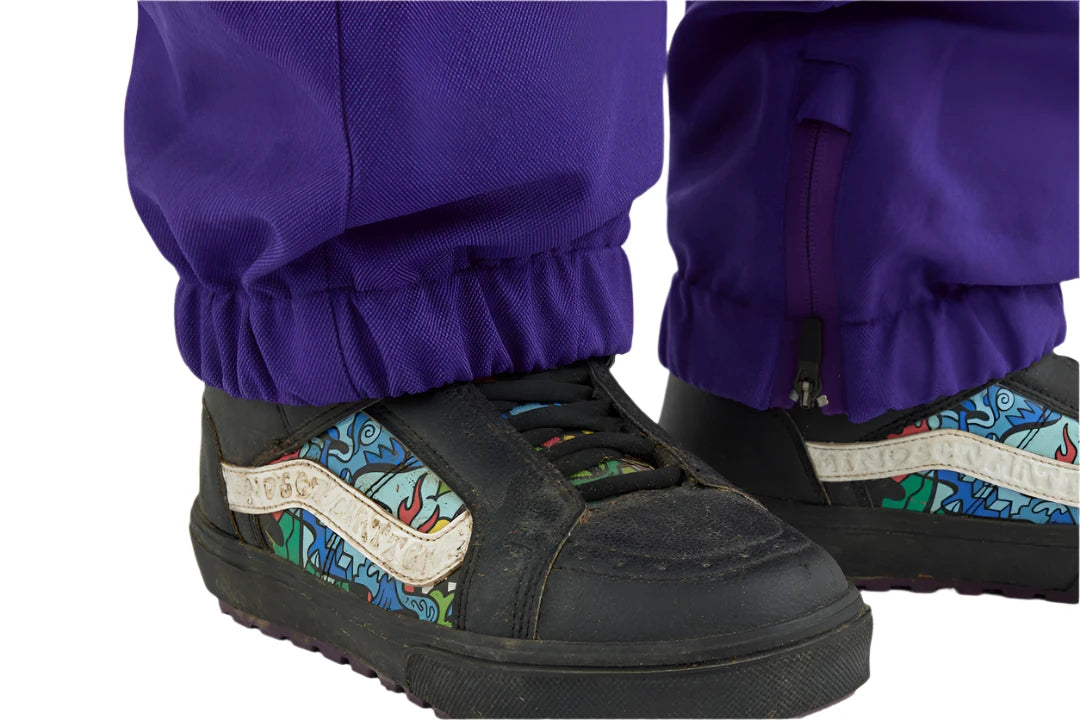 Airblaster Women's Nai Freedom Boss Pant 2025 - Black snow pants with a subtle pattern of small, light blue and green shapes on the side.