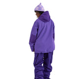 Airblaster Women's Nai Freedom Shell Pullover 2025 - A purple pullover with a hood and zippered pockets on both sides.